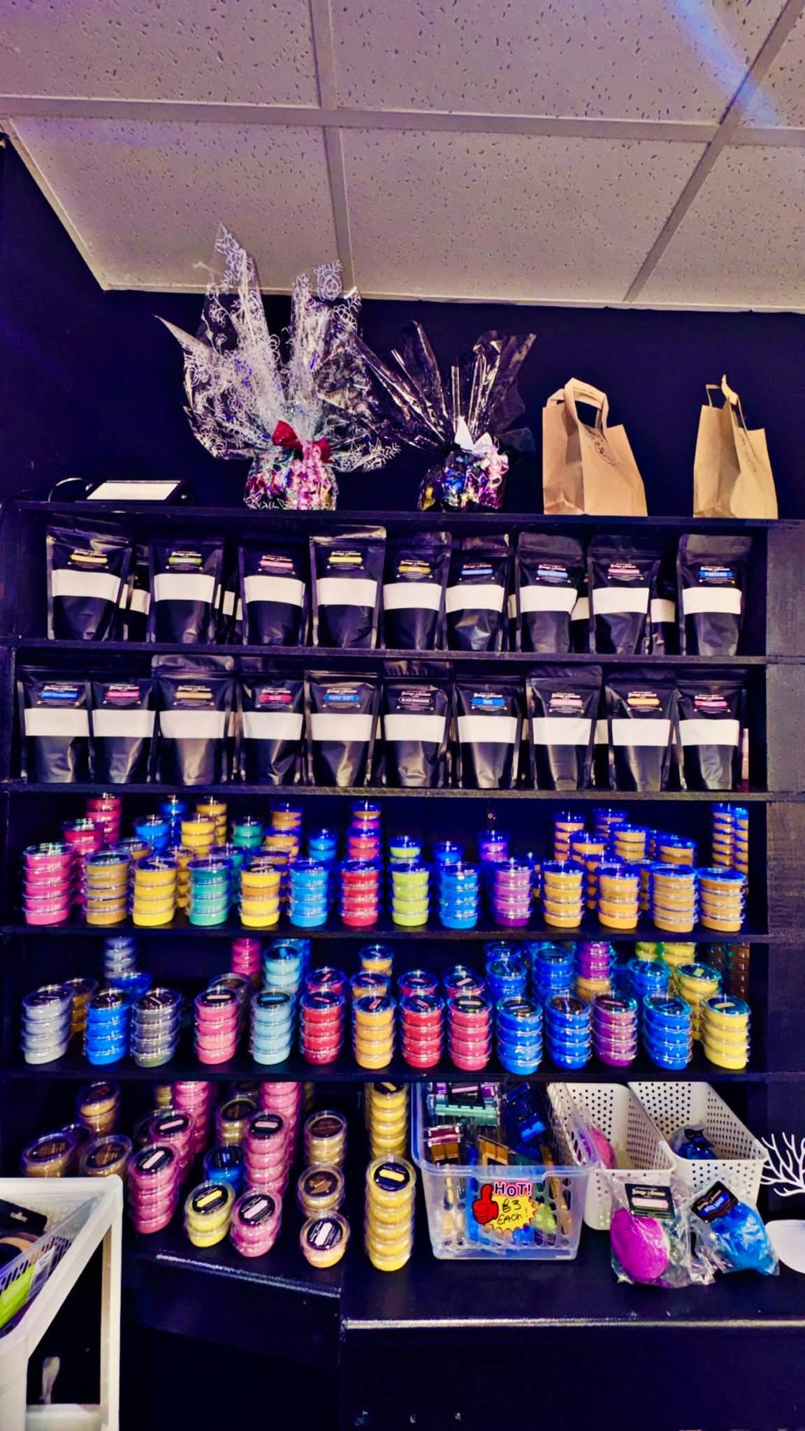 Savage Aromas product shelf with black bags and sizzlers